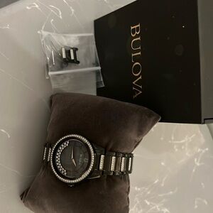 Bulova Woman’s Crystal Watch. Black with Cristal’s in face and all around band